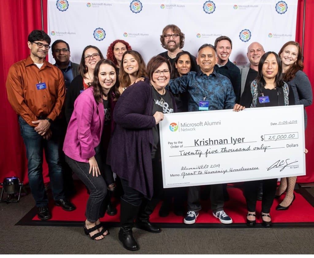Krishnan Iyer receiving the 2019 AlumniHERO award — a $25,000 Microsoft Alumni Network grant to Humanize Homelessness
